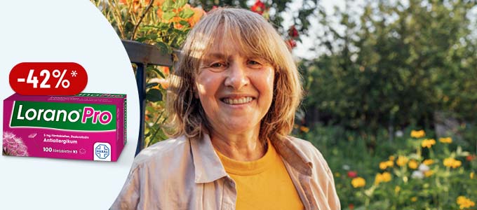 Lorano Pro Allergietabletten mit 45 % Rabatt, ältere Frau lächelt im Garten zwischen Blumen Lorano Pro Allergietabletten mit 42 % Rabatt, ältere Frau lächelt im Garten zwischen Blumen