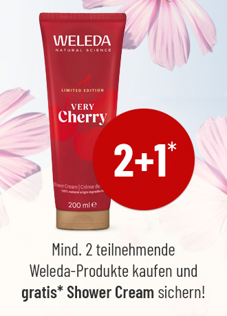 Weleda Duschcreme Very Cherry 2+1 Aktion, Tube vor Blumenhintergrund mit Hinweis auf gratis Shower Cream