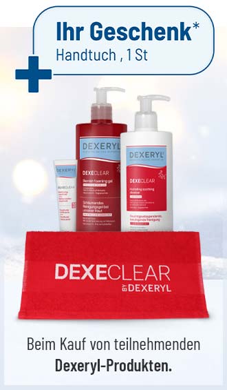 Dexeryl-Pflegeprodukte mit rotem Handtuch als Gratisgeschenk vor winterlichem Hintergrund.